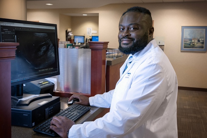 Mahmud Sam, MD in an office. 