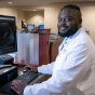 Mahmud Sam, MD in an office. 