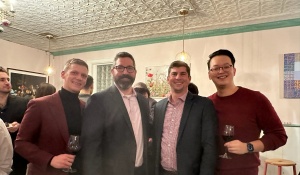 Zoom image: Residents and faculty at the department holiday party. 