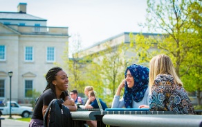 Students having a conversation outside.