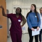 Two female and one male student participating in an IPE event. 