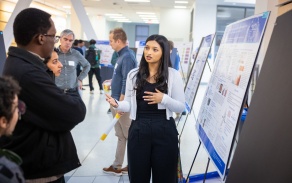 Student presenting a poster. 