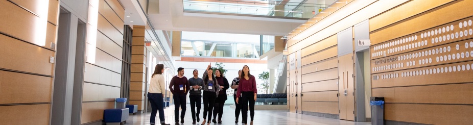 students in atrium of Jacobs School. 