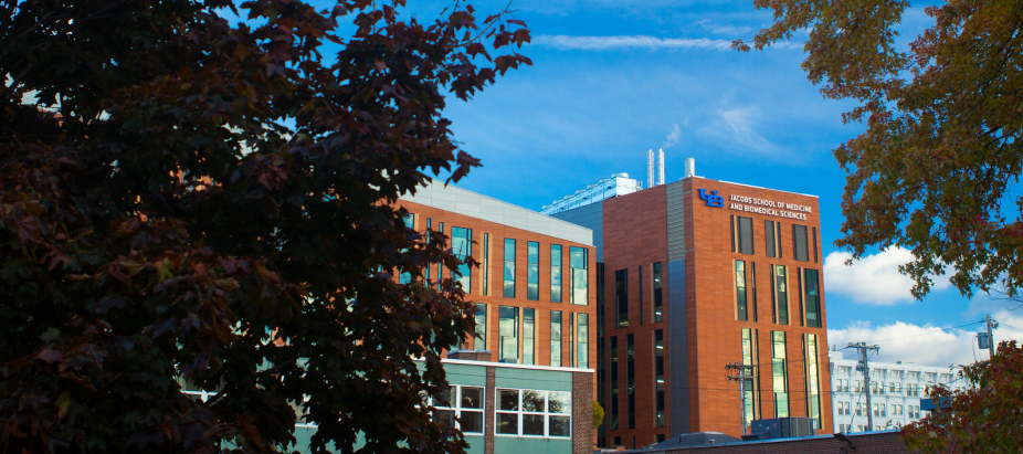 Jacobs School exterior photo with text overlay: "Your Education, Your Way.". 