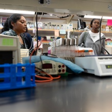 Tour visiting a lab. 