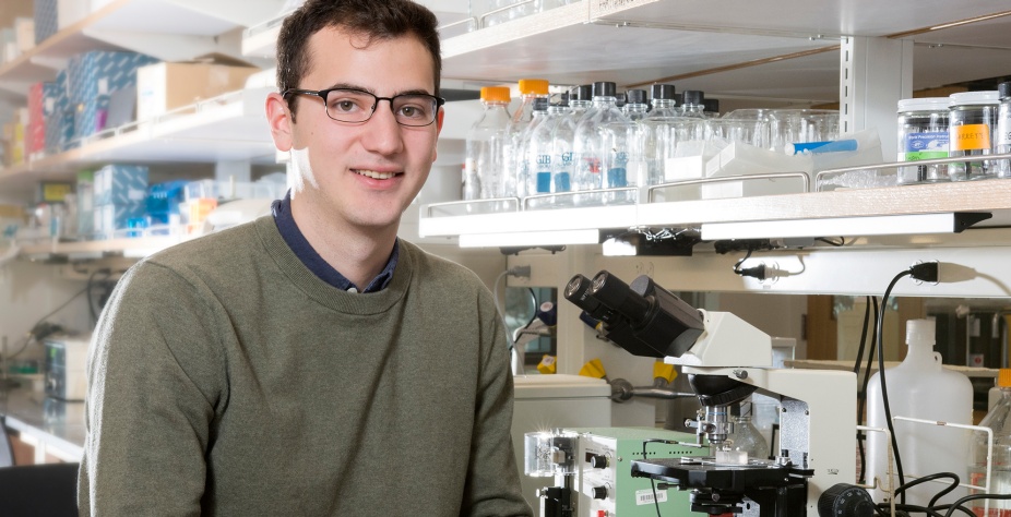 PhD student Garrett Sheehan in lab. 