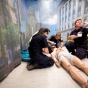 Three students simulate an emergency call. 