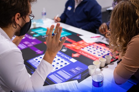 Students playing a health-related game during a game night. 