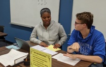 students working together in tutoring center. 