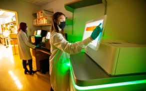 Students touching screens. 