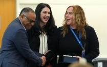Dr. Reeb accepting a token of appreciation from Dr. Milling and Dr. Meka. 