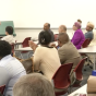 People listen at the Remembrance Conference. 