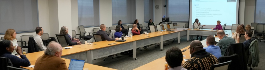 Faculty around a table at a Faculty Affairs Fall Welcome Breakfast event. 