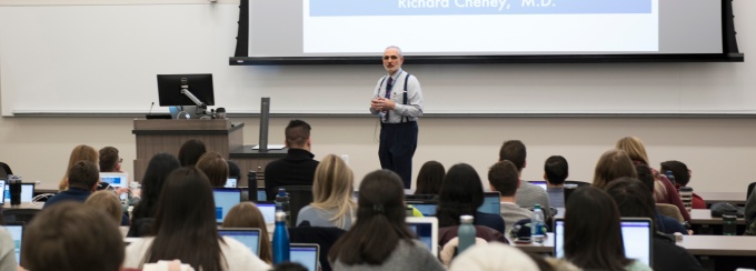 Alan J. Lesse, MD, associate dean for medical curriculum, addresses a lecture hall full of students. 