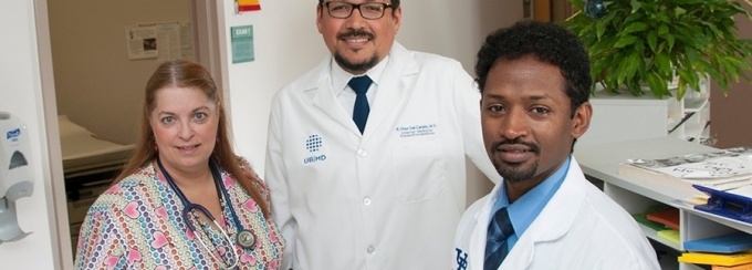 Dr. Roberto Diaz Del Carpio (center), Department of Medicine, serves as an advocate. 