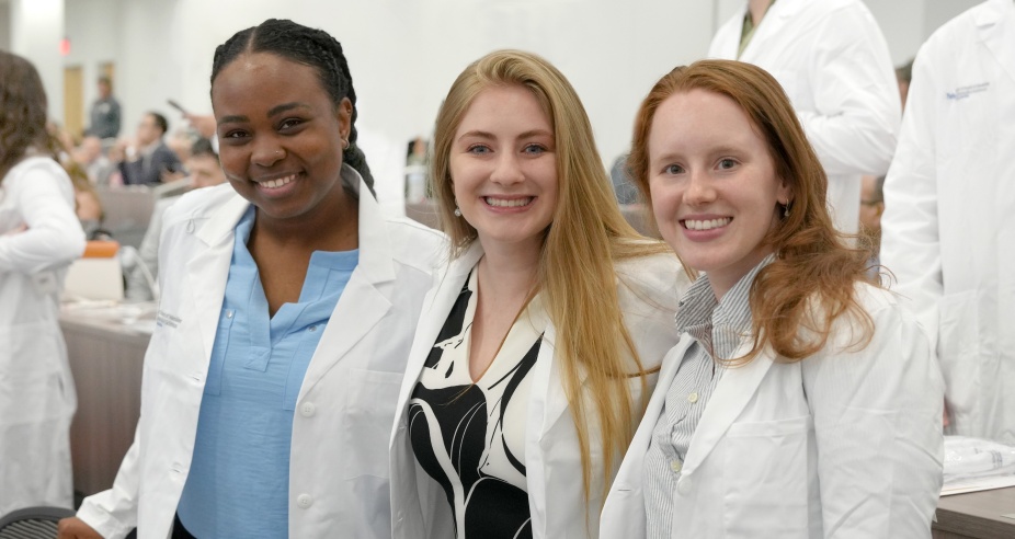 Residents wearing their long white coats before the ceremony. 