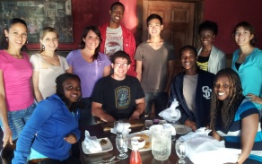 Group of students gathered around a table. 