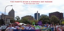 Zoom image: Photo of a parade line with the words Puerto Rican and Hispanic Day Parade