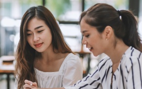 Royalty-free stock photo ID: 2086945537 Two young Asian businesswoman discuss investment project working and planning strategy. Business people talking together with laptop computer at office. 