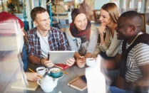 Group of people gathered around a table. 