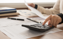 Close-up of someone using a calculator. 