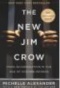 The New Jim Crow, book cover. Hands on jail bars. 