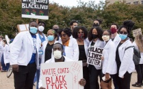 White Coats Black Lives street picture of group of medical students. 