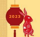 Red Rabitt next to a red chinese lamp that reads 2023. 