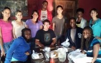 Group of students gathered around a table.