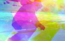 Silouette of a male figure skiing in rainbow colorful background. 