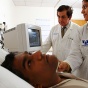 Lead investigator Paresh Dandona working with a patient. 