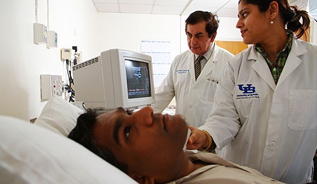 Lead investigator Paresh Dandona working with a patient. 