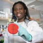 Essie Tchalla works in a lab. 