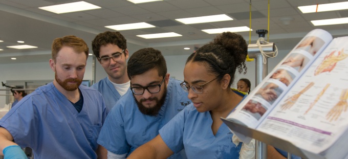Students work in the gross anatomy lab. 