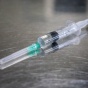 A syringe. 