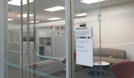Office suite waiting area with cubicles. 