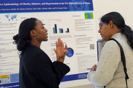 Third-year medical student Adebo Addo explains her research at the medical stduent research forum.